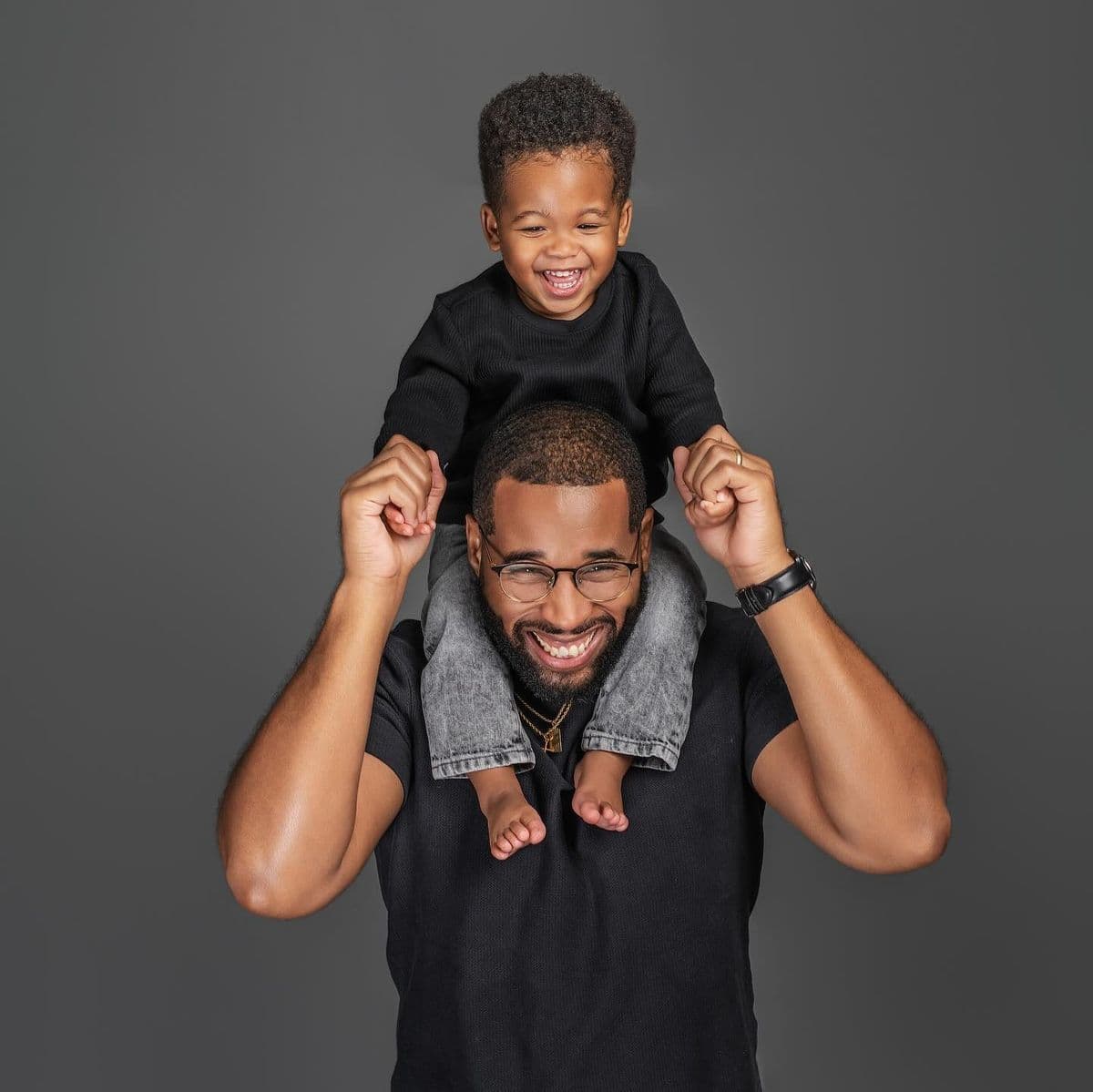 A father carrying his baby in his arms